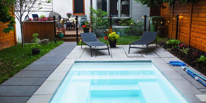 Small pool surrounded by two chairs